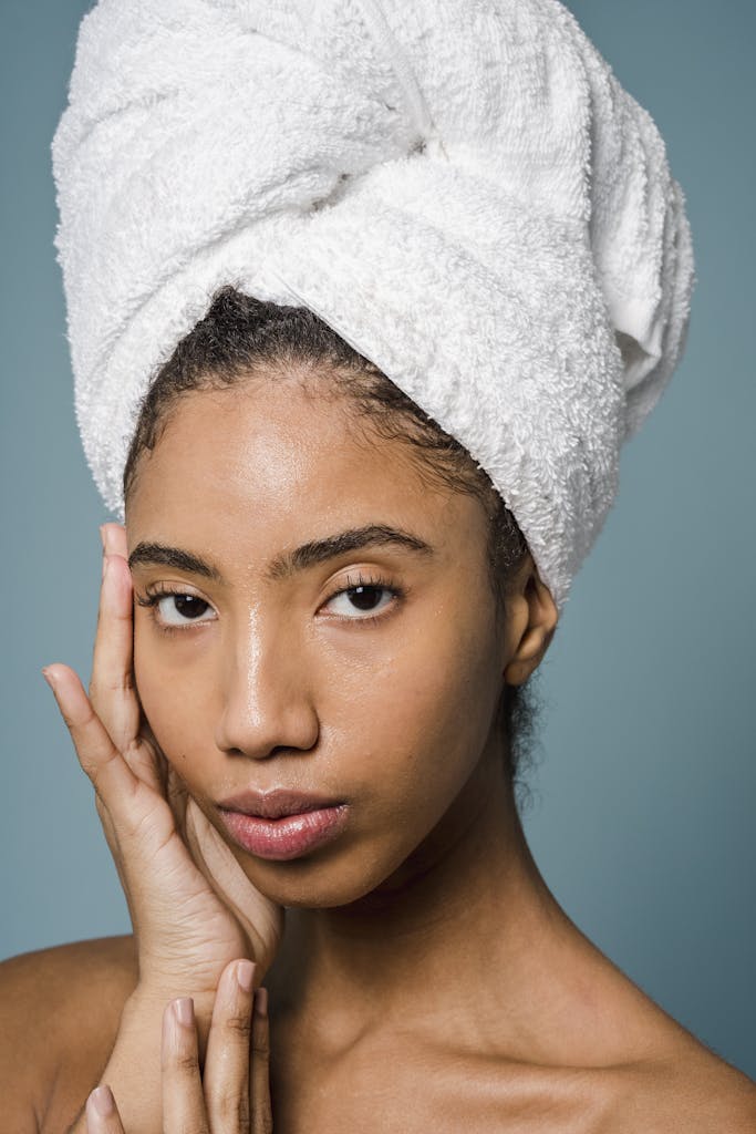 Confident woman with fresh, radiant skin smiling softly, reflecting the results of BIODANCE’s best self-care products for glowing skin and anti-aging.