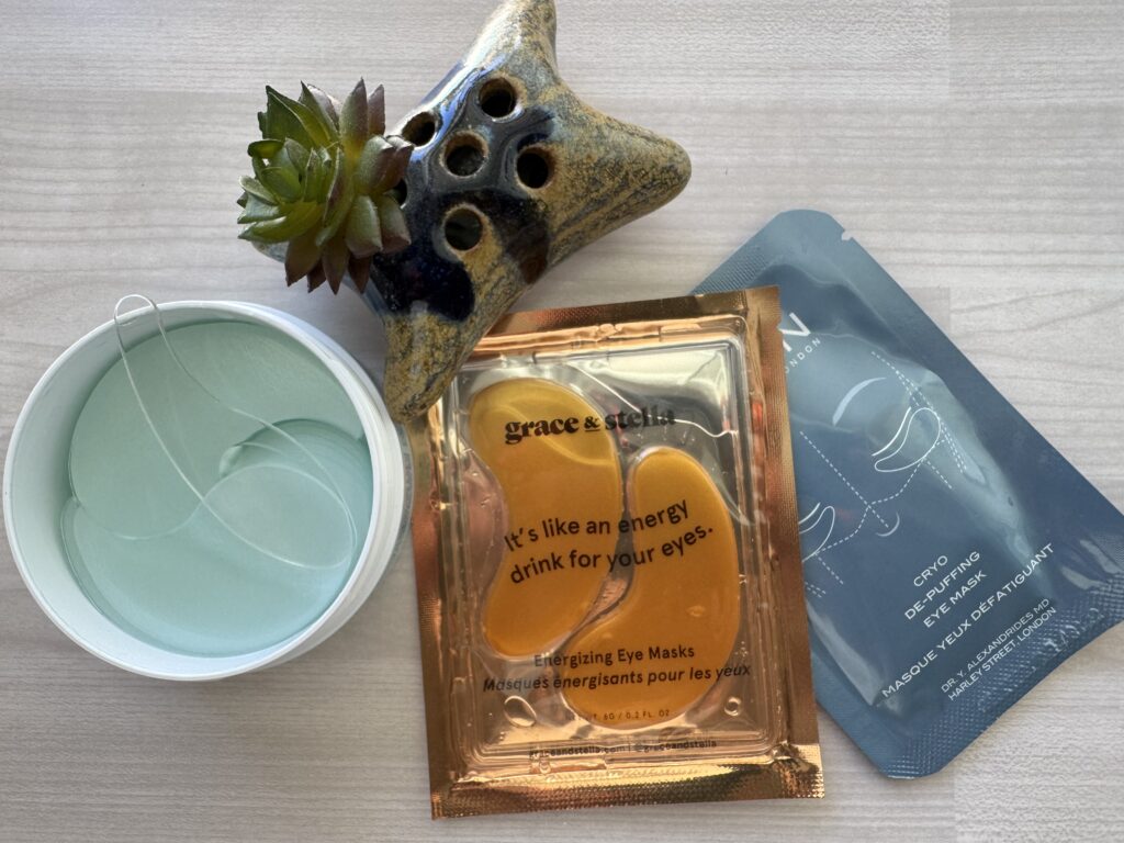various eye masks on a table with plant