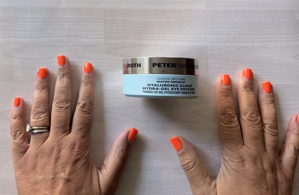 eye patches for morning skin care routine between hands