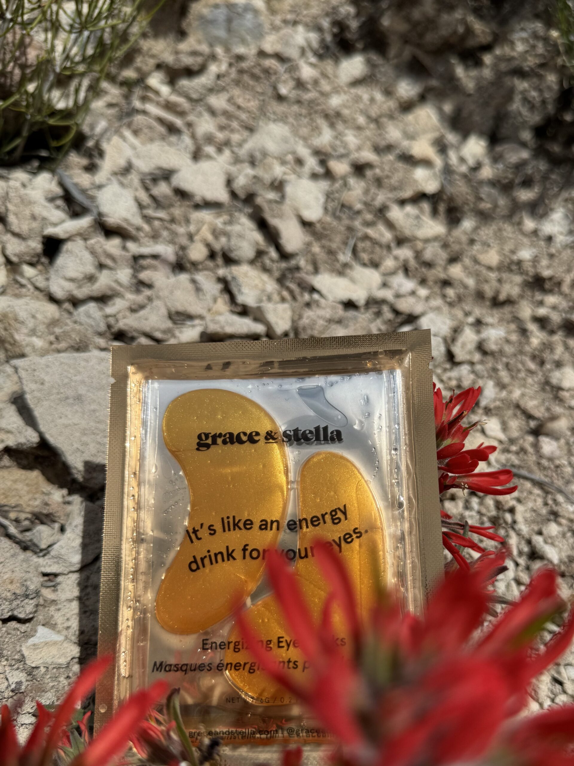 eye patched in wild desert flowers in rock