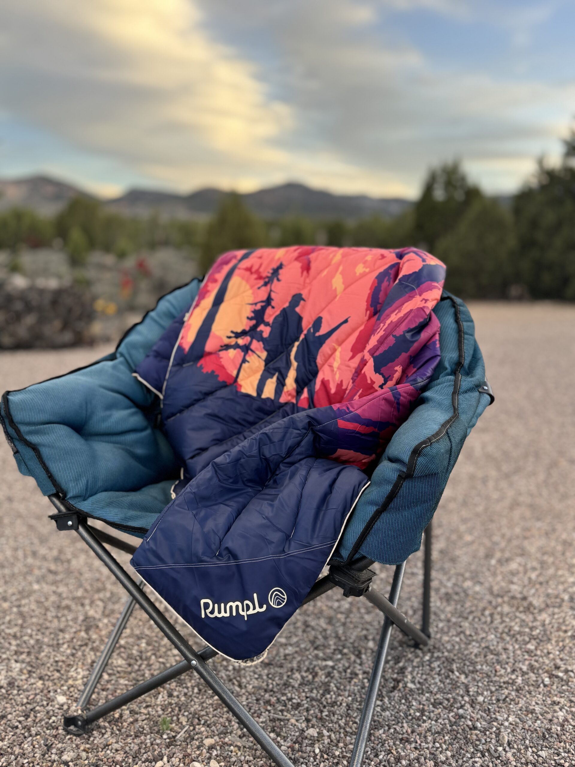 Rumpl blanket on camping chair at sunset