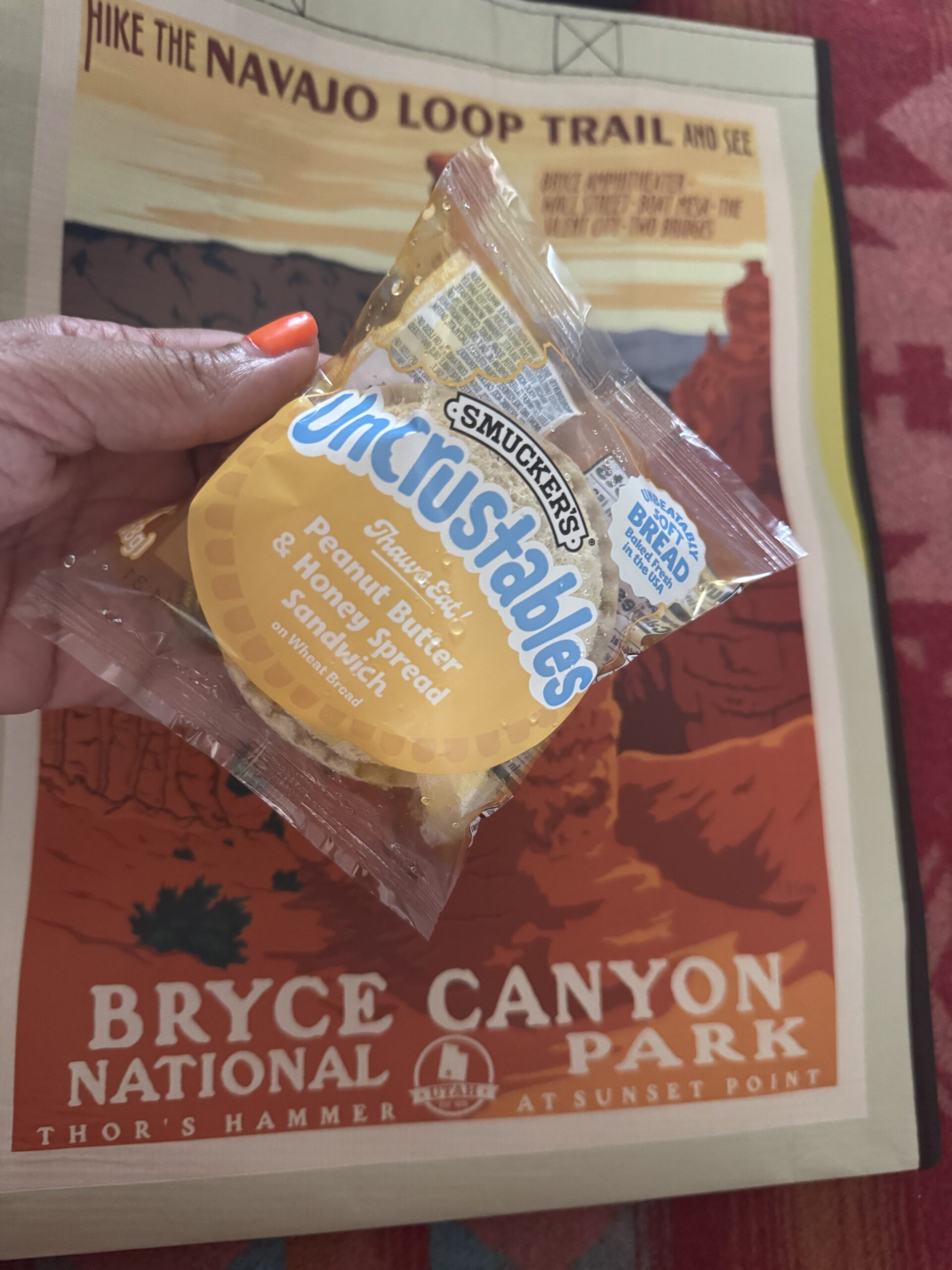 uncrustable peanut butter and honey sandwich with bryce canyon bag background